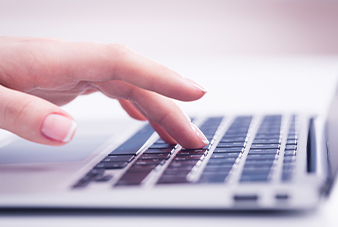 Hand on computer keyboard